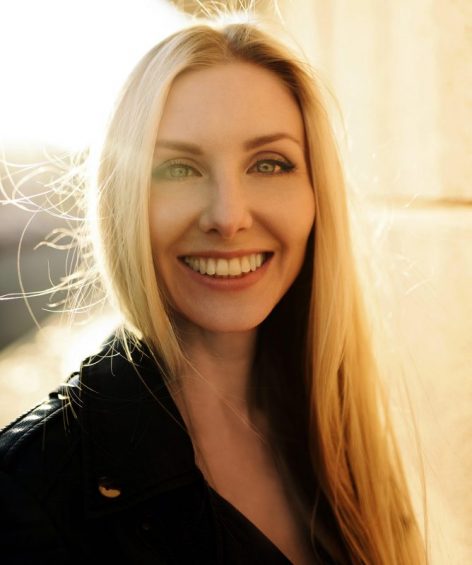 woman smiling with sunshine